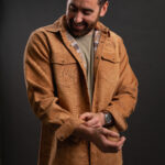 Thumbnail of http://Bearded%20man%20wearing%20tan%20corduroy%20shacket%20with%20ONX%20logo%20and%20fixing%20his%20sleeve