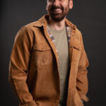 Thumbnail of http://Bearded%20man%20looking%20out%20in%20the%20distance%20wearing%20a%20tan%20corduroy%20shacket%20with%20the%20ONX%20logo