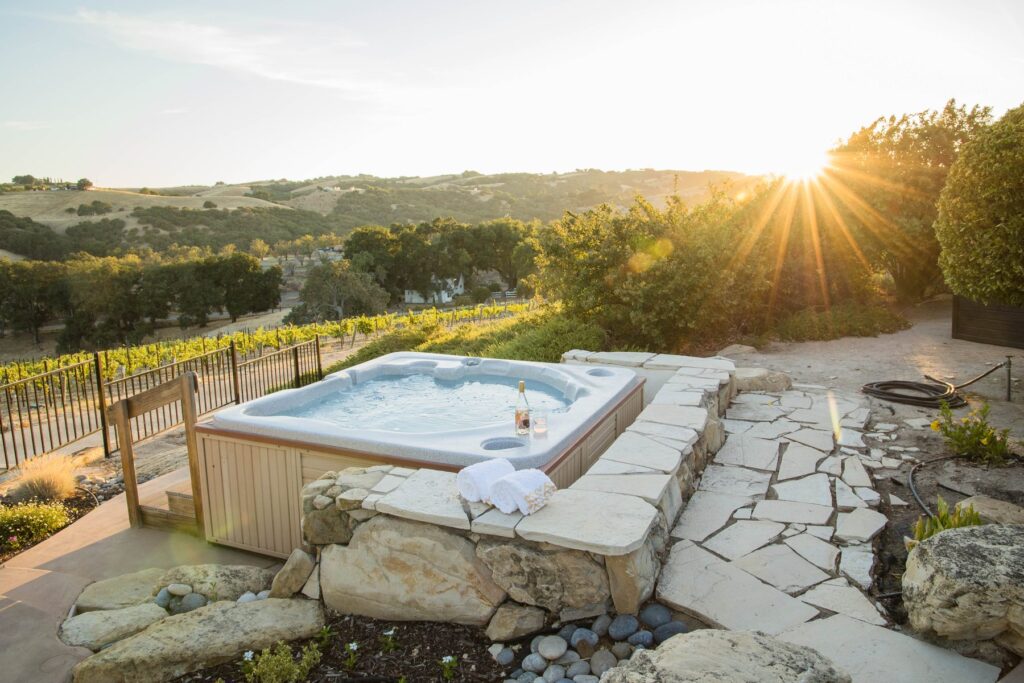 Kiler Canyon Ranch House outdoor hot tub at sunset
